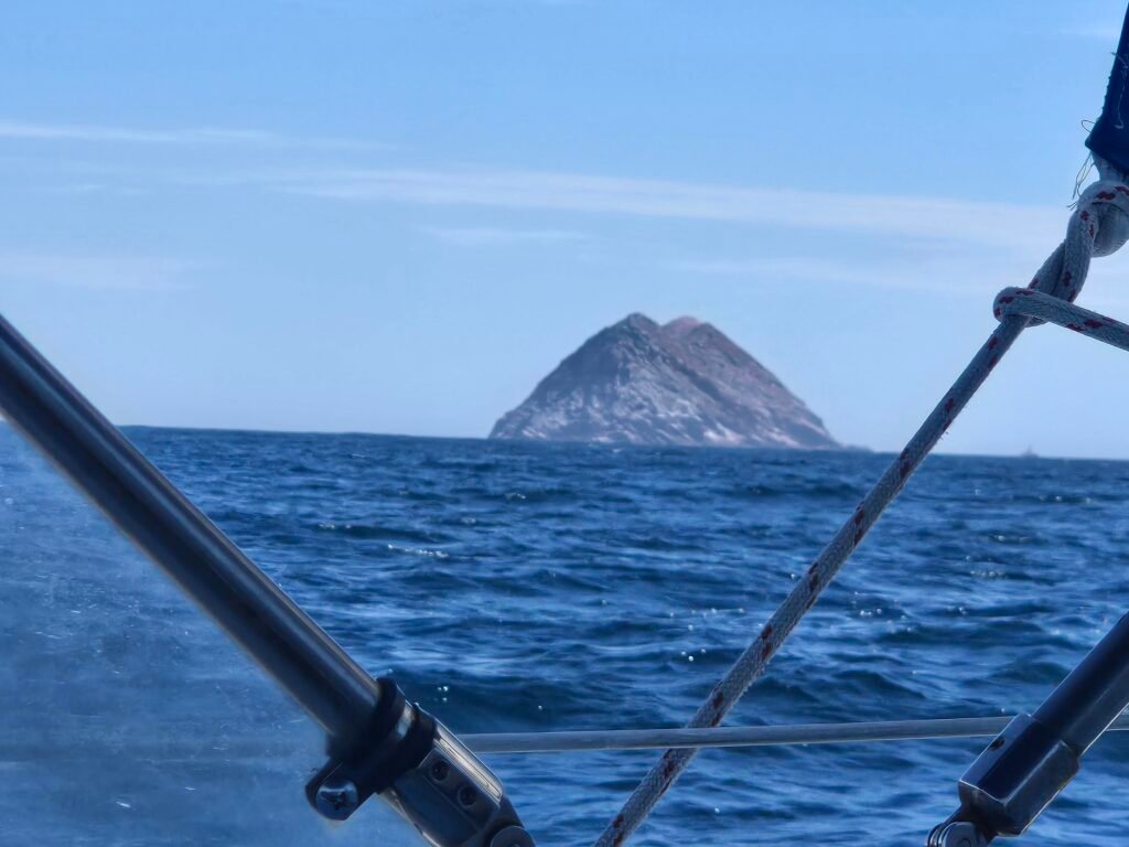 Sailing the open ocean off San Diego with the Coronado Islands of Mexico on the horizon
