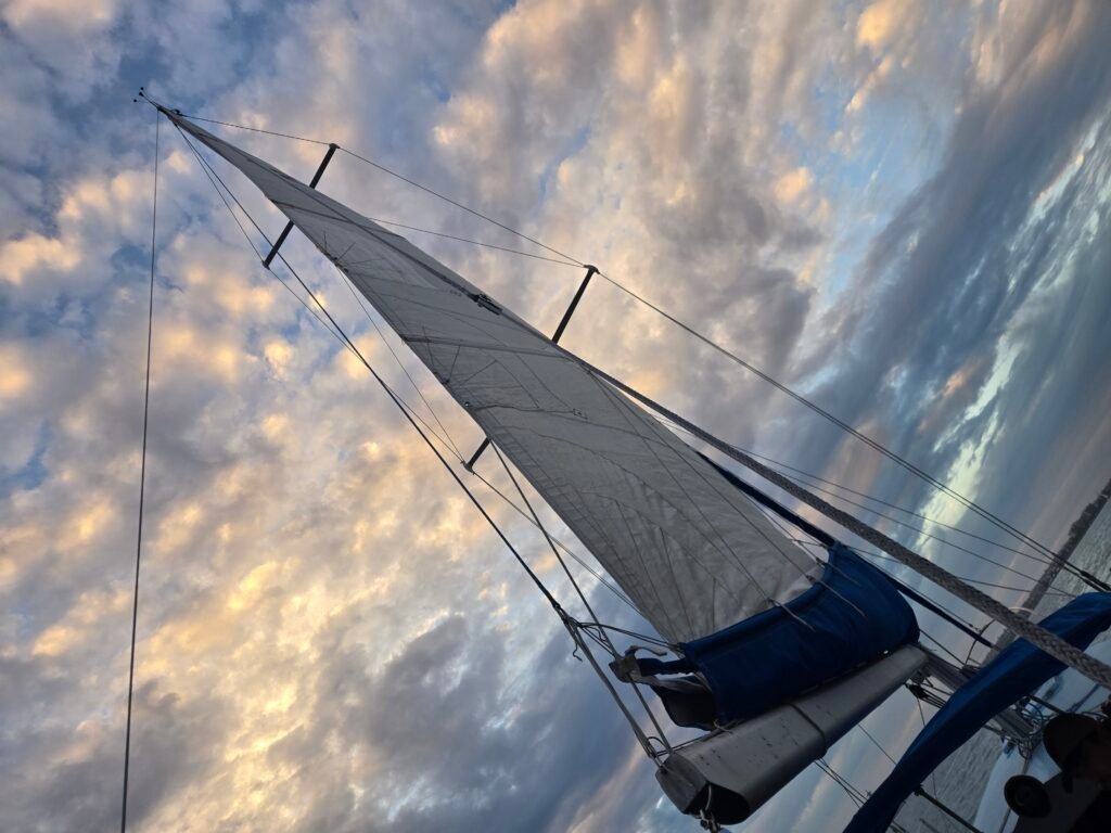 Wolf's sails against a cloudy sky