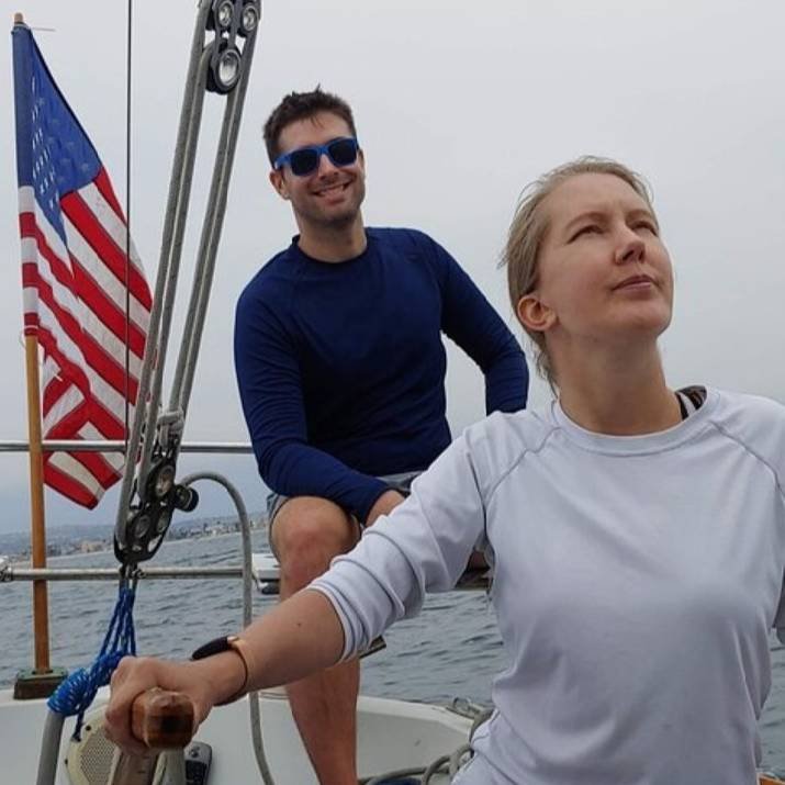 Steering by tiller while observing tell-tails, leatrning how to sail